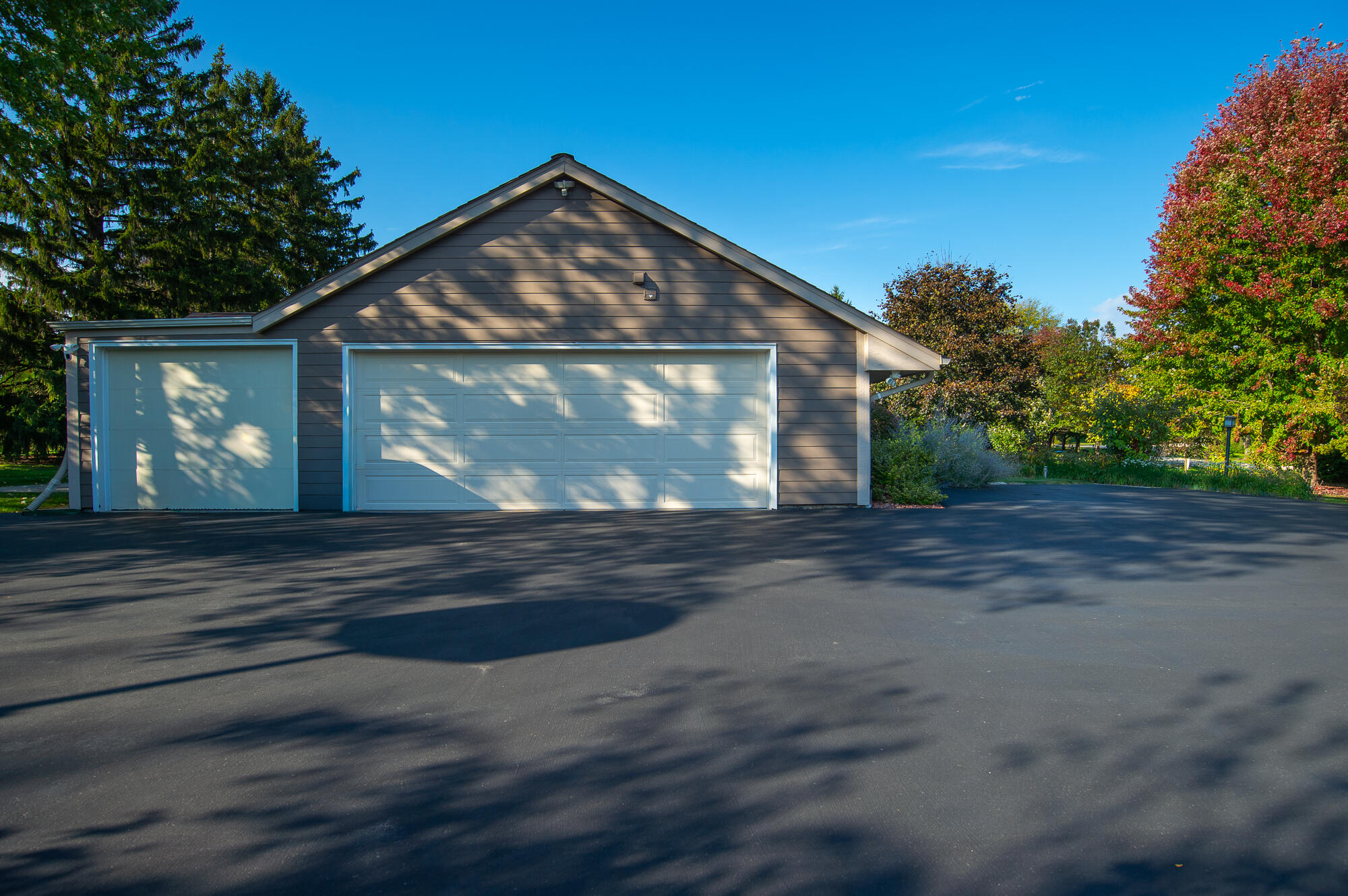 4024 South Brook Road Caledonia, WI 53126 - Photo 46 of 66 Large 3 car attached garage and spacious parking area providing plenty of room for multiple vehicles