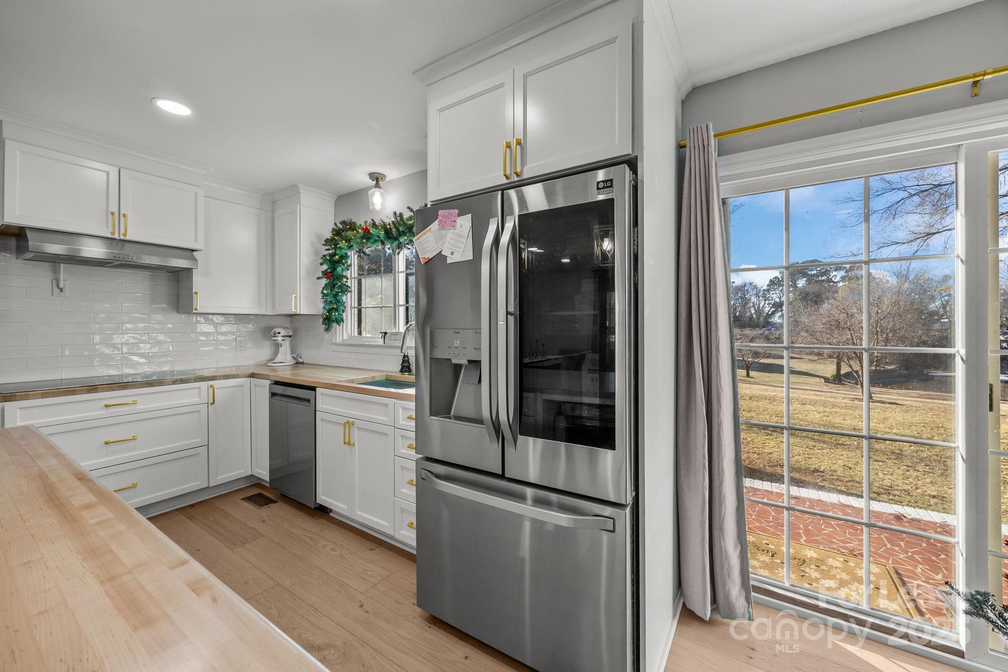 4611 Kiser Island Road Terrell, NC 28682 - Photo 14 of 40 a kitchen with a refrigerator and a sink