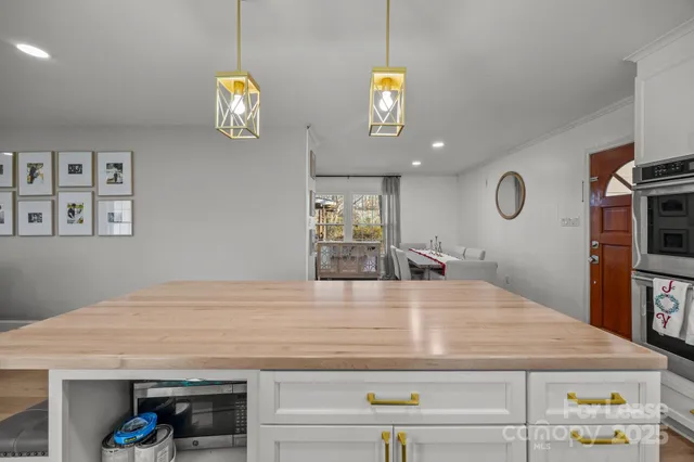 a view of kitchen island with wooden floor