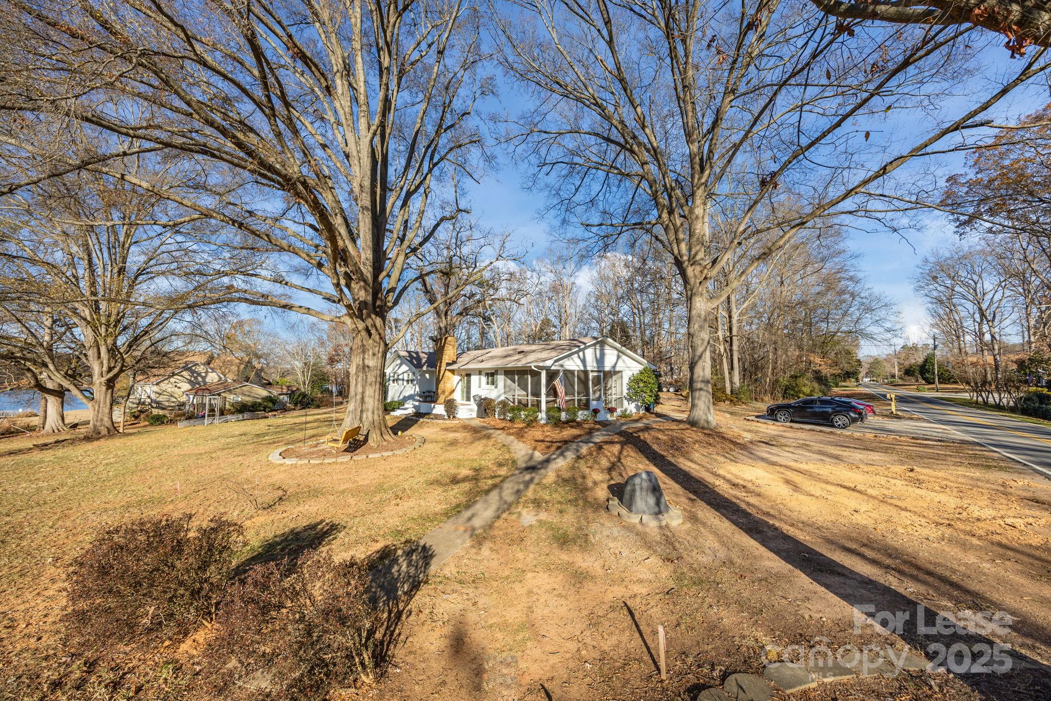 4611 Kiser Island Road Terrell, NC 28682 - Photo 32 of 40 a view of a yard with trees and covered with snow