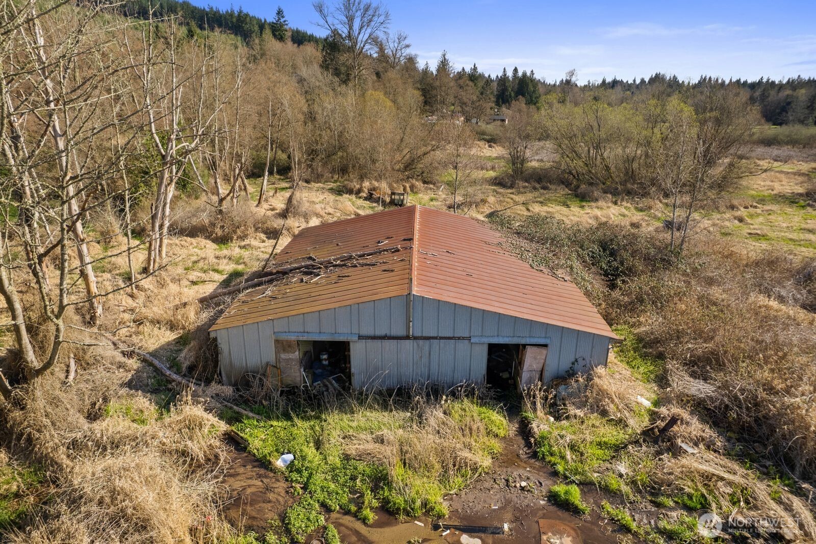 21314 Starbird Road Mount Vernon, WA 98274 - Photo 28 of 35 a view of a wooden house with a yard