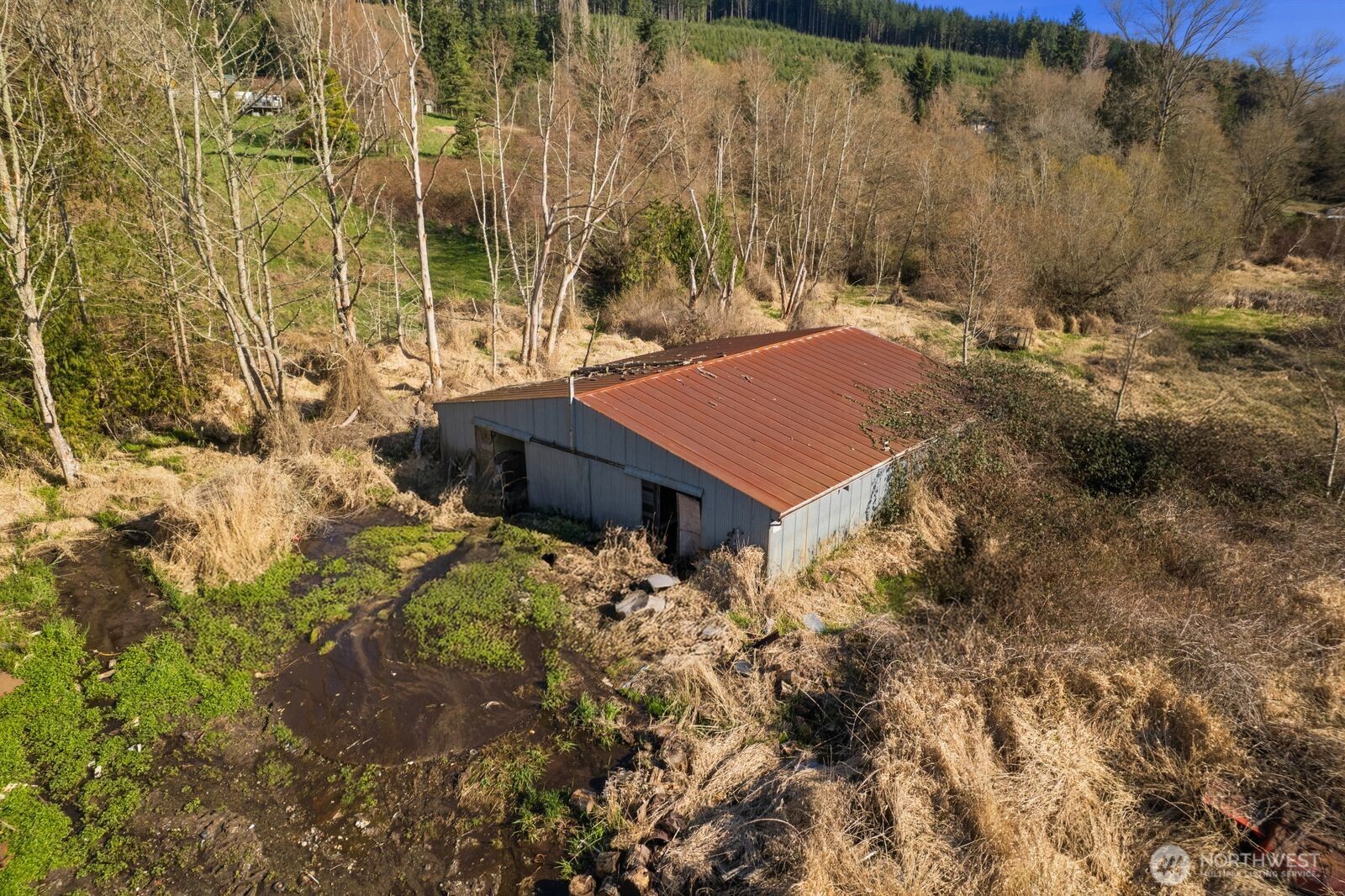 21314 Starbird Road Mount Vernon, WA 98274 - Photo 29 of 35 a view of a house with a yard and sitting area