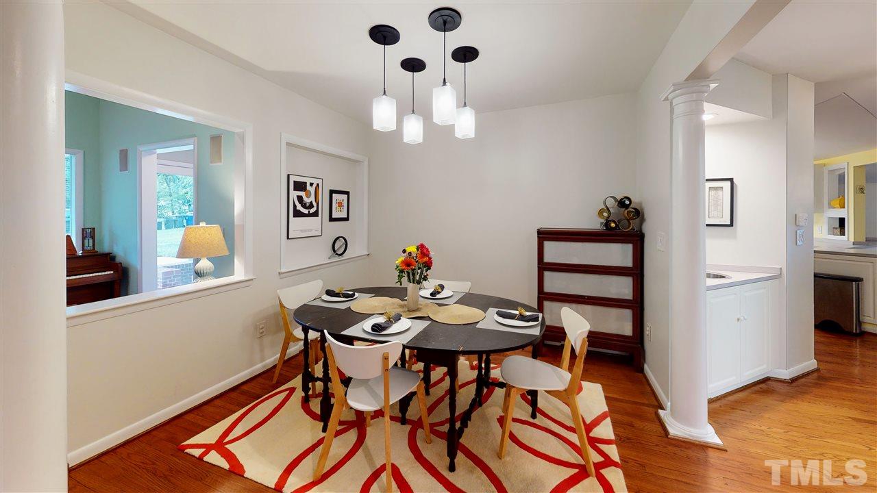 4212 Windsor Place Raleigh, NC 27609 - Photo 17 of 30 a view of a dining room with furniture and chandelier