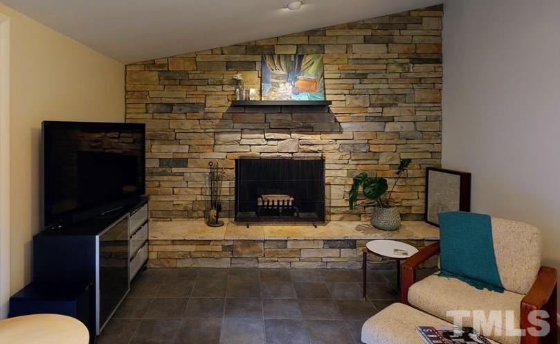 4212 Windsor Place Raleigh, NC 27609 - Photo 19 of 30 a living room with furniture and a fireplace