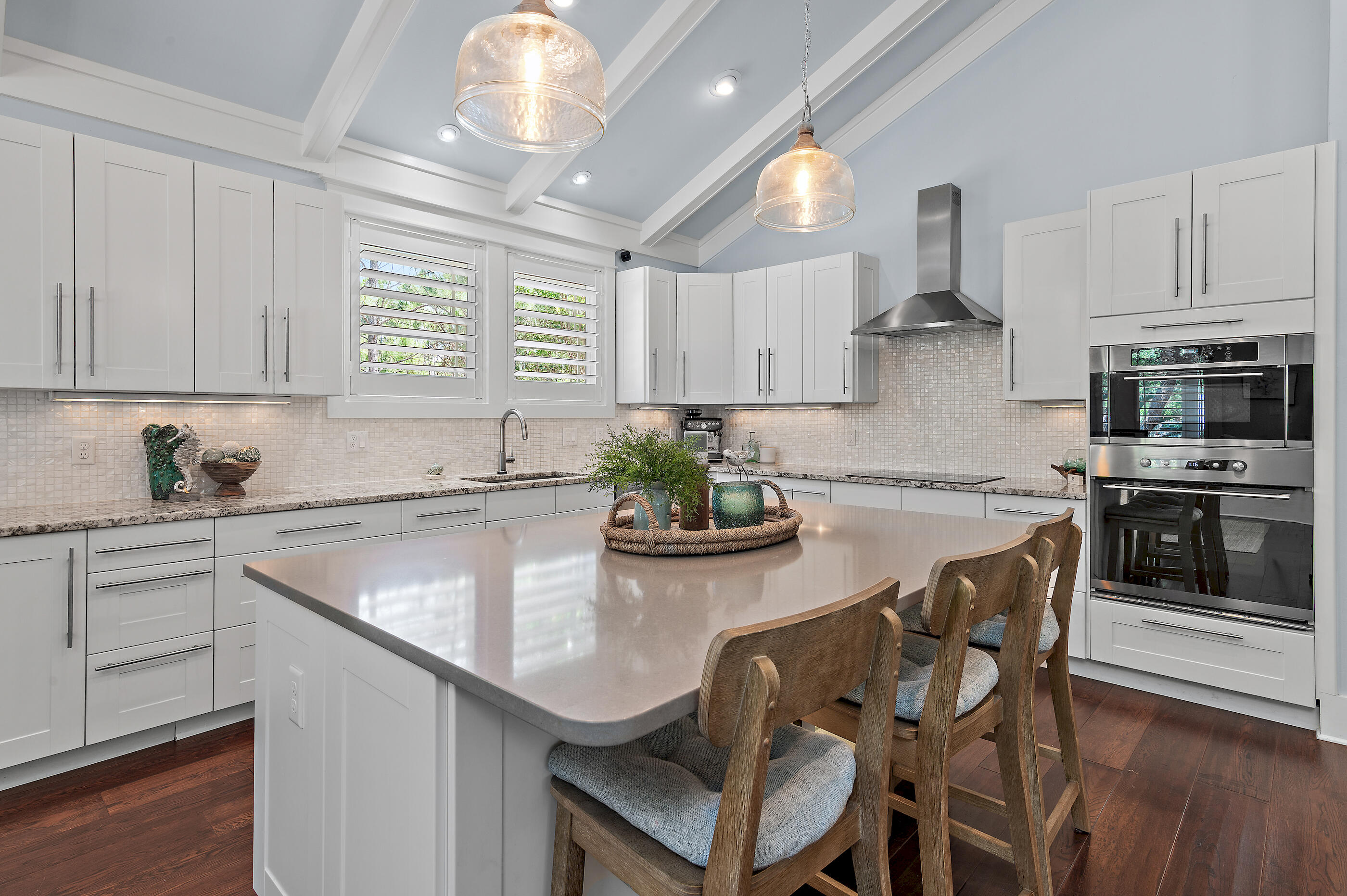 104 Spotted Dolphin Road Santa Rosa Beach, FL 32459 - Photo 11 of 42 a kitchen with stainless steel appliances granite countertop a sink a stove a microwave a dining table and chairs