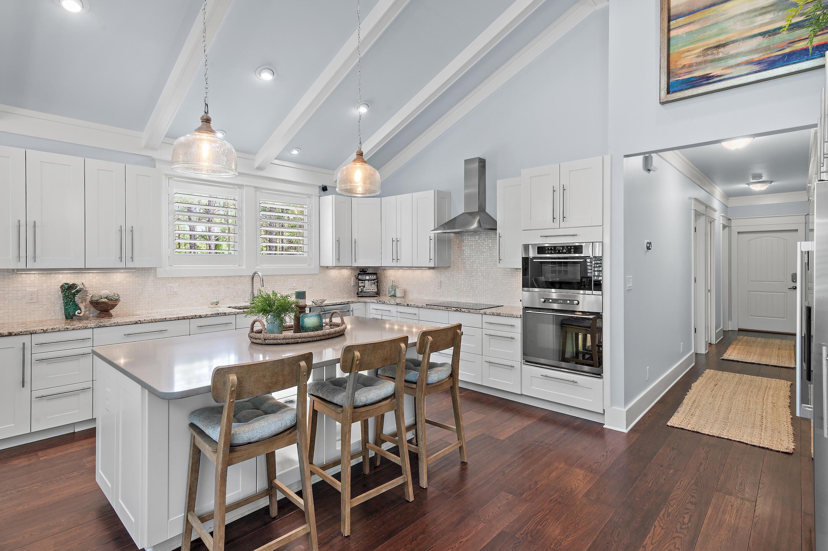 104 Spotted Dolphin Road Santa Rosa Beach, FL 32459 - Photo 13 of 42 a kitchen with stainless steel appliances a dining table chairs stove and cabinets