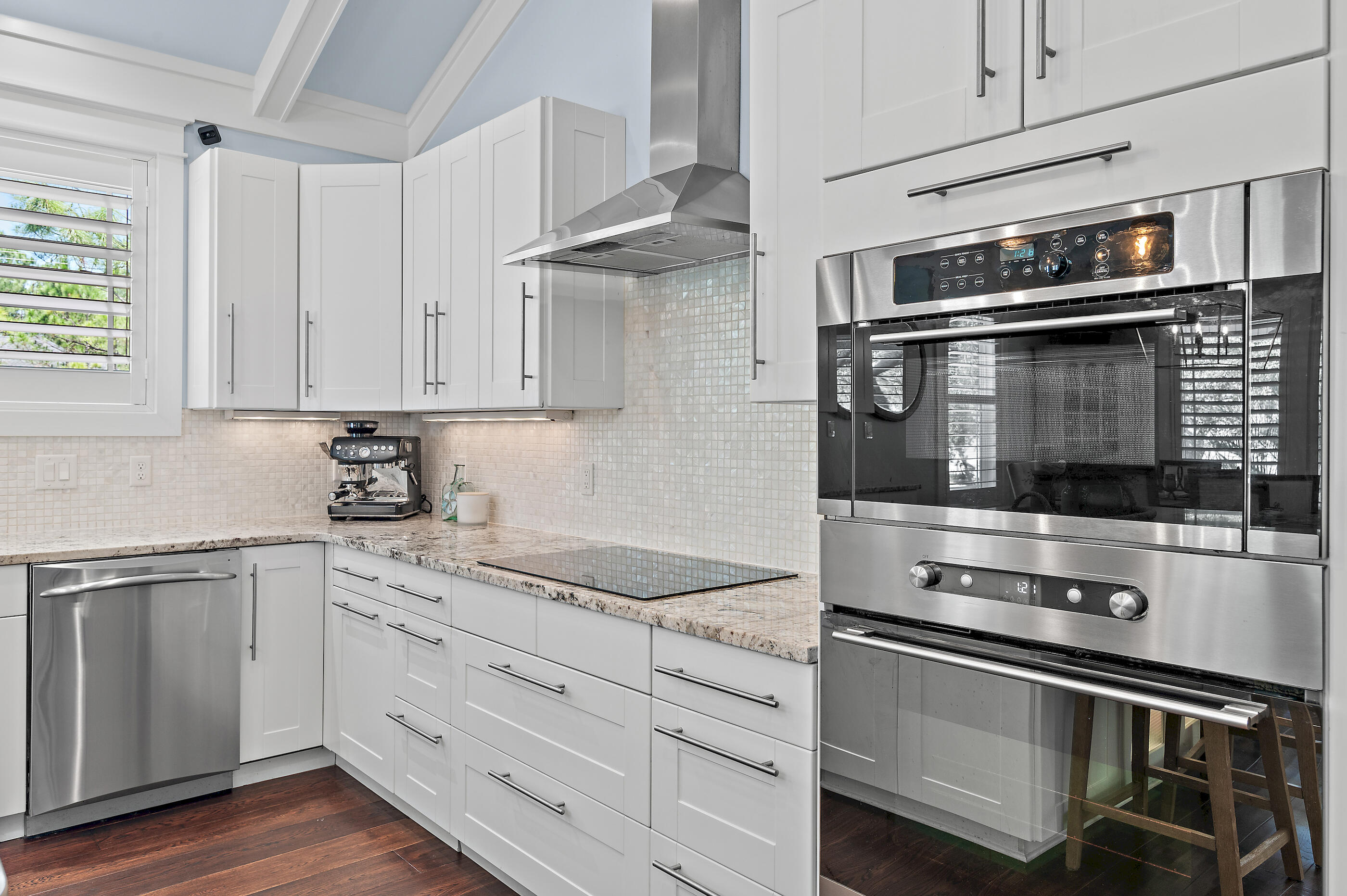 104 Spotted Dolphin Road Santa Rosa Beach, FL 32459 - Photo 16 of 42 a kitchen with granite countertop cabinets stainless steel appliances and a window