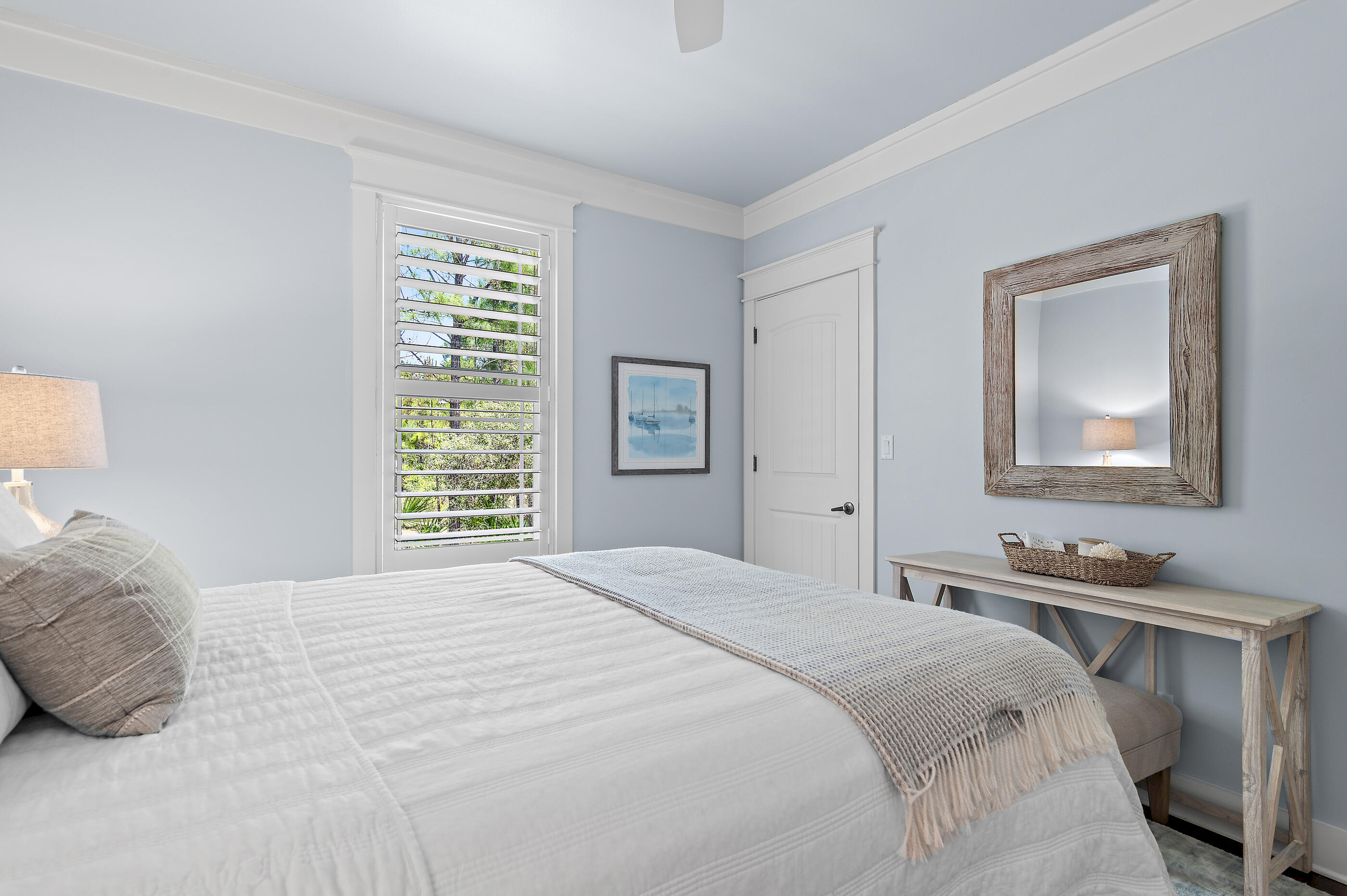 104 Spotted Dolphin Road Santa Rosa Beach, FL 32459 - Photo 24 of 42 a bedroom with a bed and a lamp on dresser