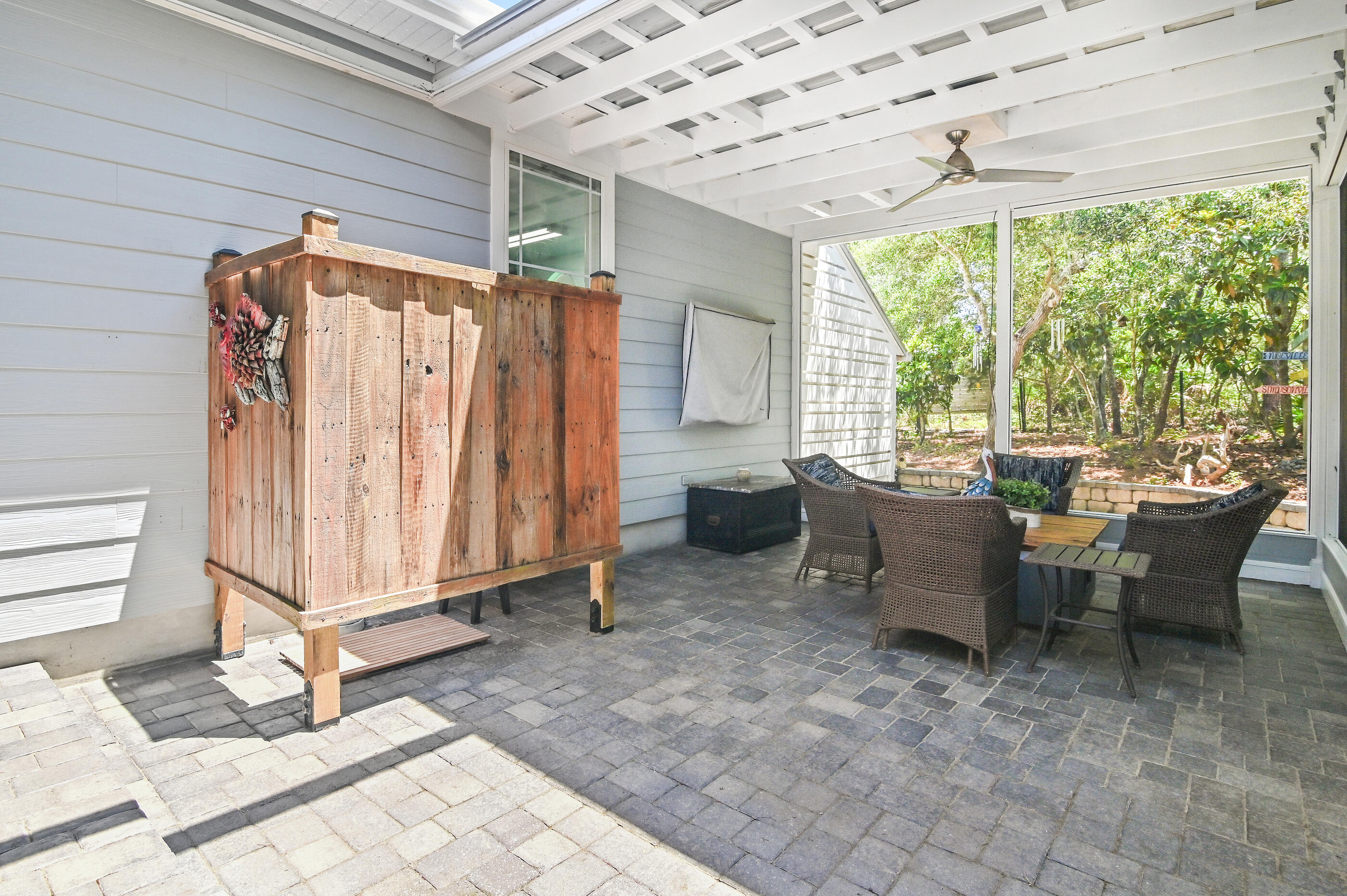 104 Spotted Dolphin Road Santa Rosa Beach, FL 32459 - Photo 28 of 42 a view of a patio with a table and chairs