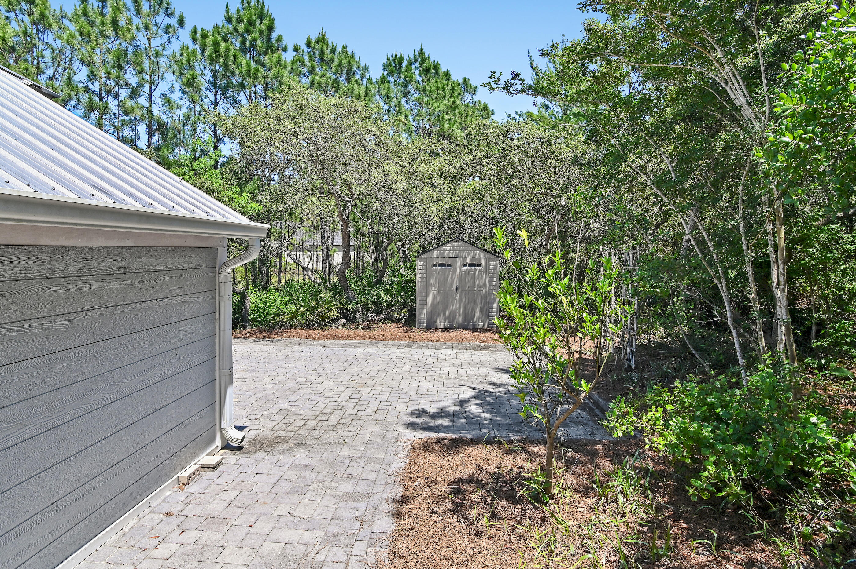 104 Spotted Dolphin Road Santa Rosa Beach, FL 32459 - Photo 33 of 42 a backyard of a house with lots of green space