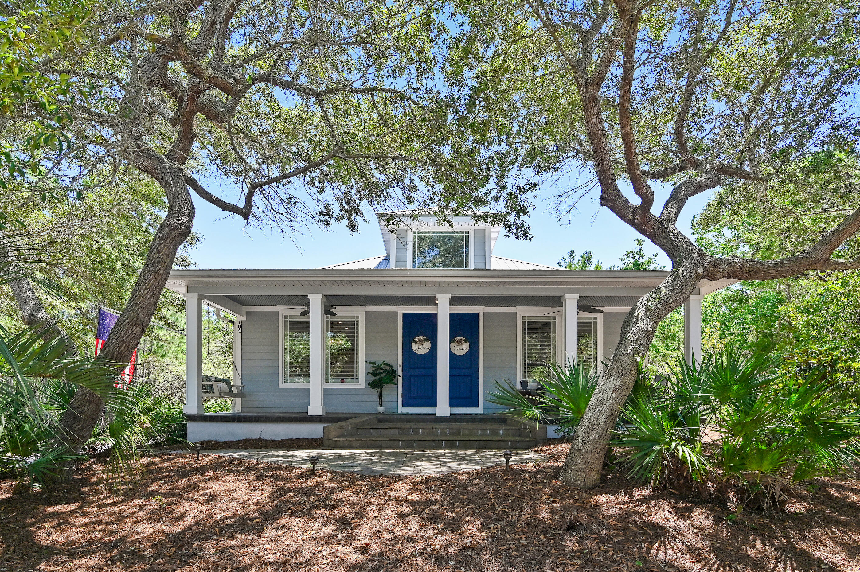 104 Spotted Dolphin Road Santa Rosa Beach, FL 32459 - Photo 5 of 42 front view of a house with a tree