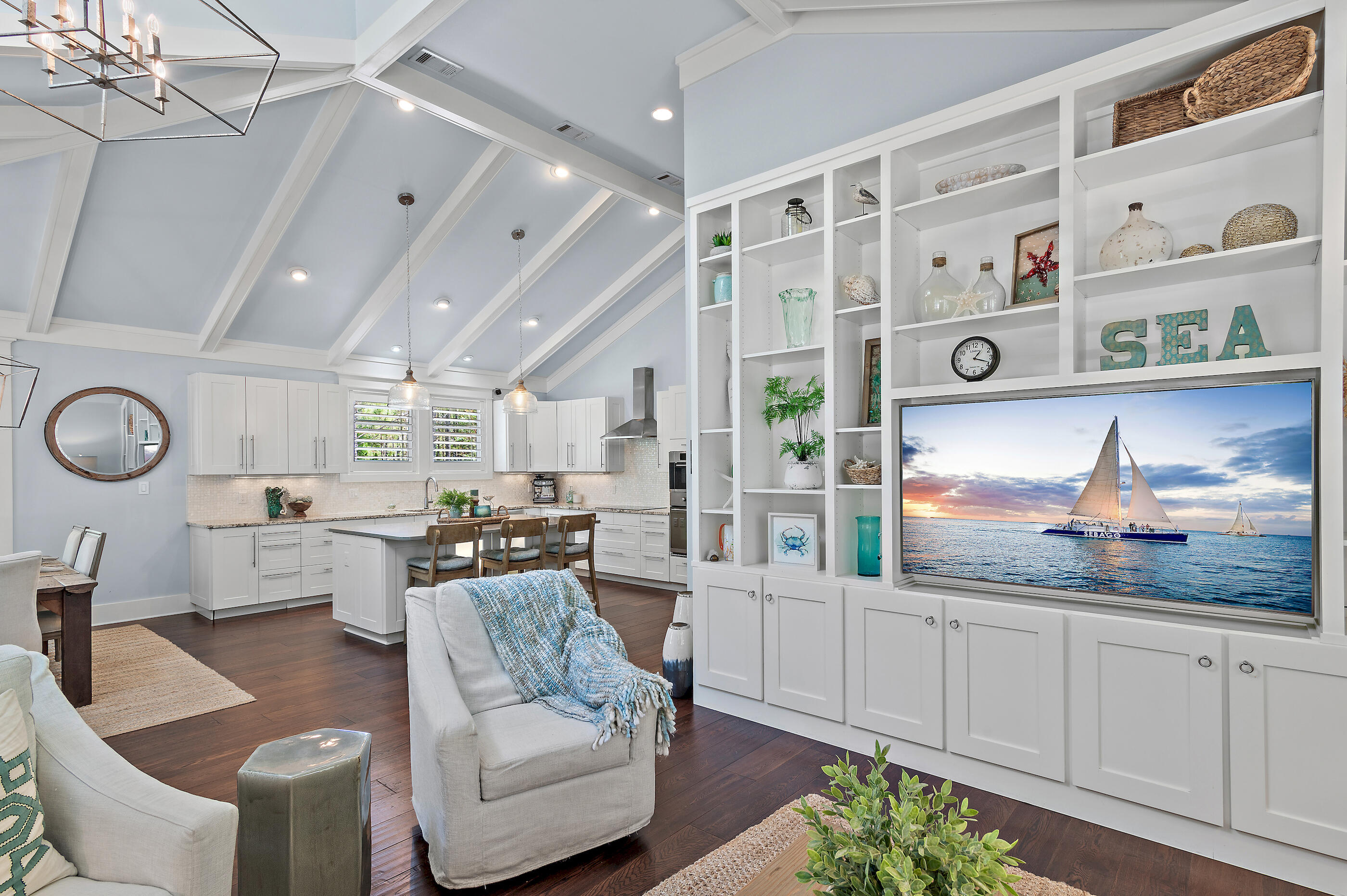104 Spotted Dolphin Road Santa Rosa Beach, FL 32459 - Photo 10 of 42 a kitchen with stainless steel appliances kitchen island granite countertop a stove and white cabinets