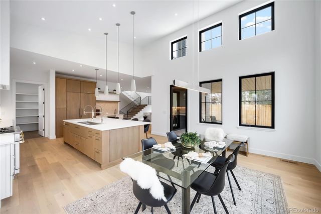 a view of kitchen with furniture and wooden floor