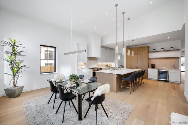 a view of a dining room with furniture and a table