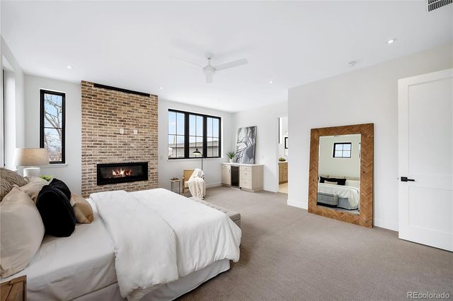 a bedroom with a bed and a couch