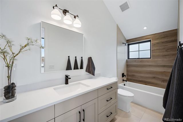 a view of a hall with wooden floor