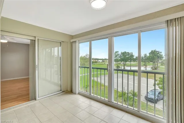 a view of a room with sliding glass door and mountain view
