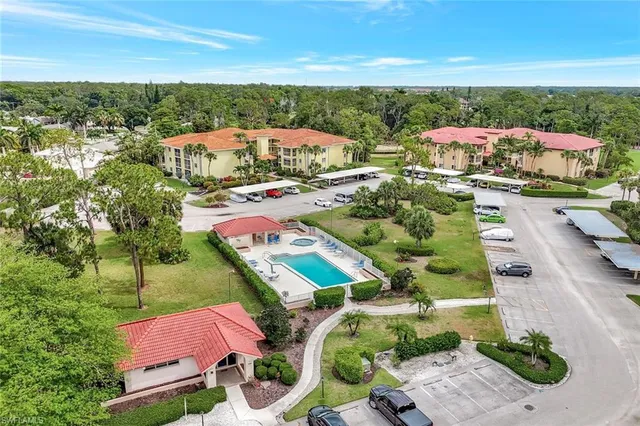 an aerial view of residential houses with outdoor space