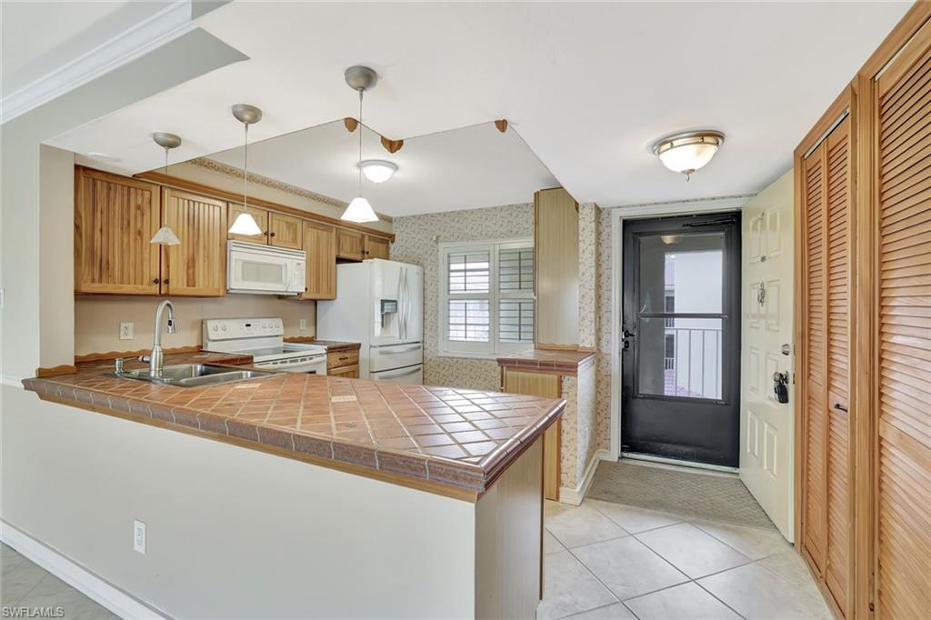 1051 Foxfire Lane, Unit 309 Naples, FL 34104 - Photo 6 of 34