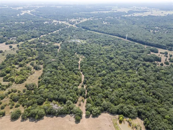 an aerial view of residential house and outdoor space