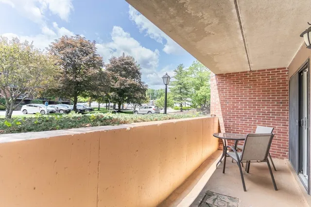 a view of swimming pool with outdoor seating and yard in back