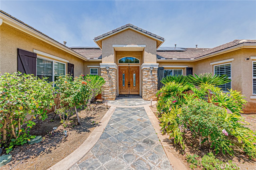 4088 Shady Ridge Circle Corona, CA 92881 - Photo 1 of 47 a front view of a house with garden