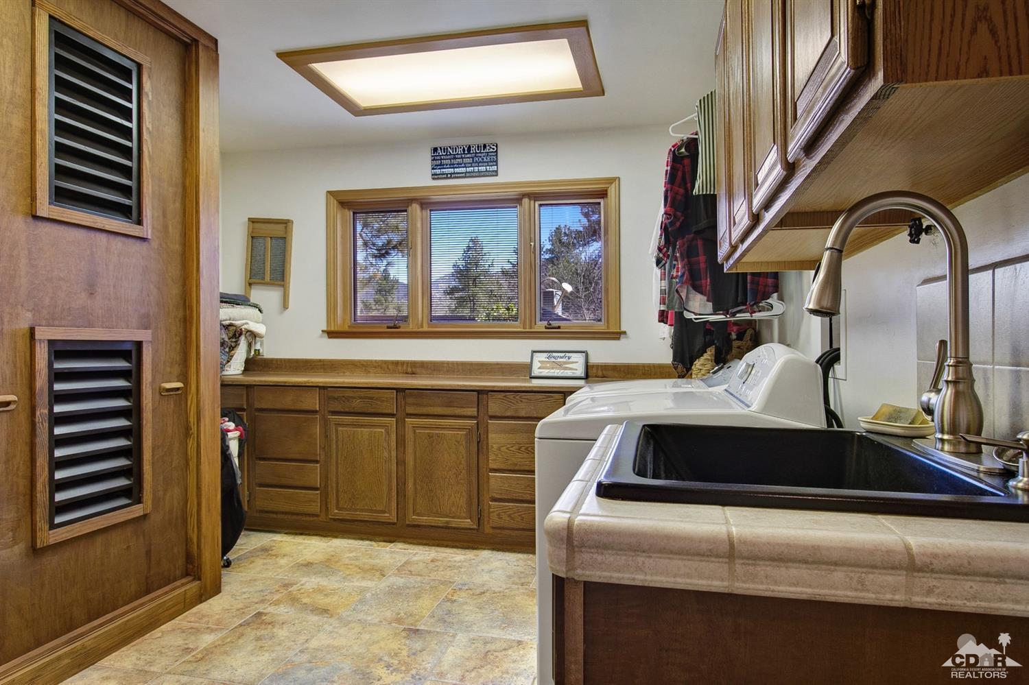 35945 Tool Box Spring Road Mountain Center, CA 92561 - Photo 14 of 53 a bathroom with a sink and a mirror