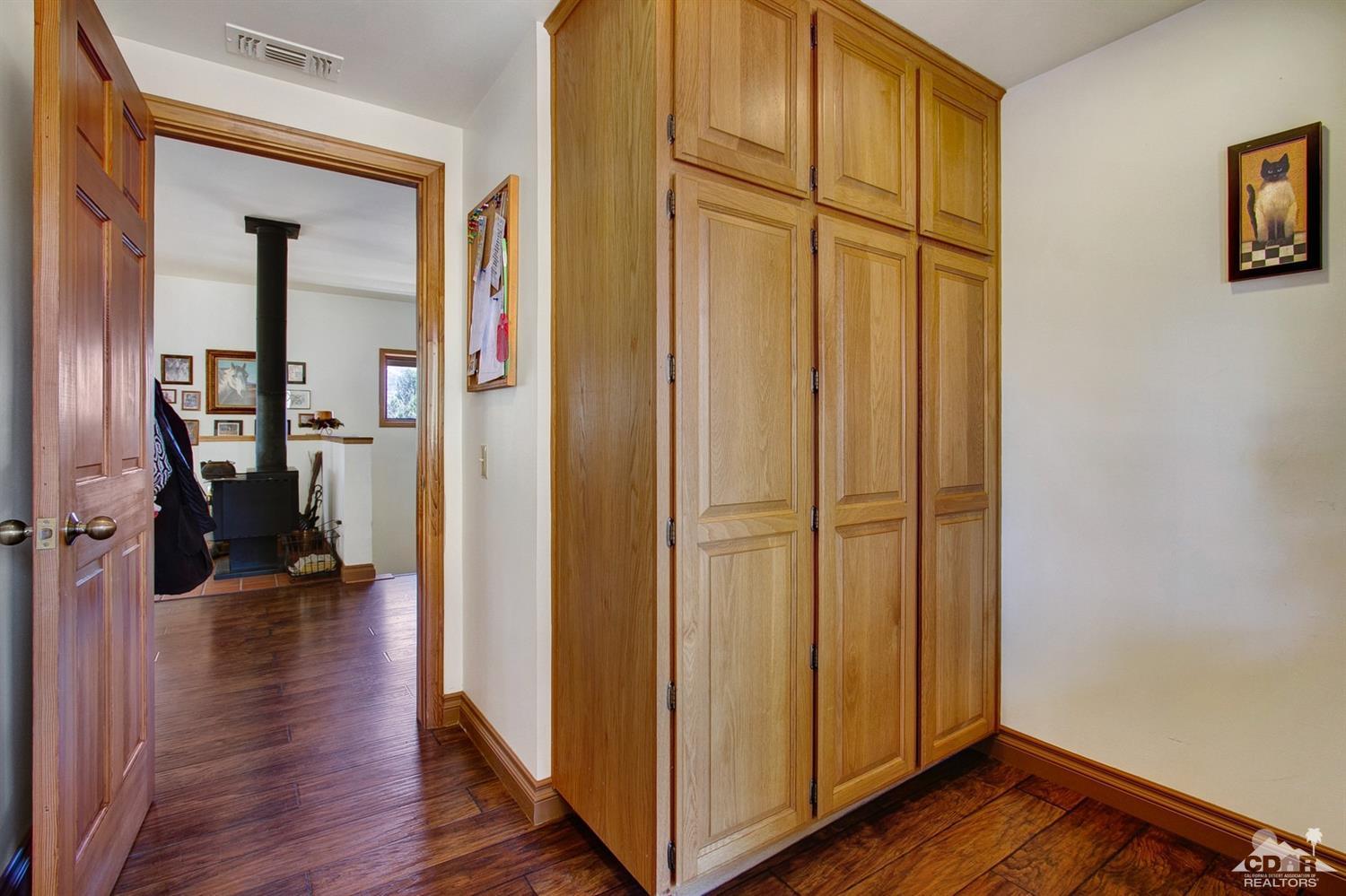 35945 Tool Box Spring Road Mountain Center, CA 92561 - Photo 22 of 53 a view of a hallway with wooden floor and closet