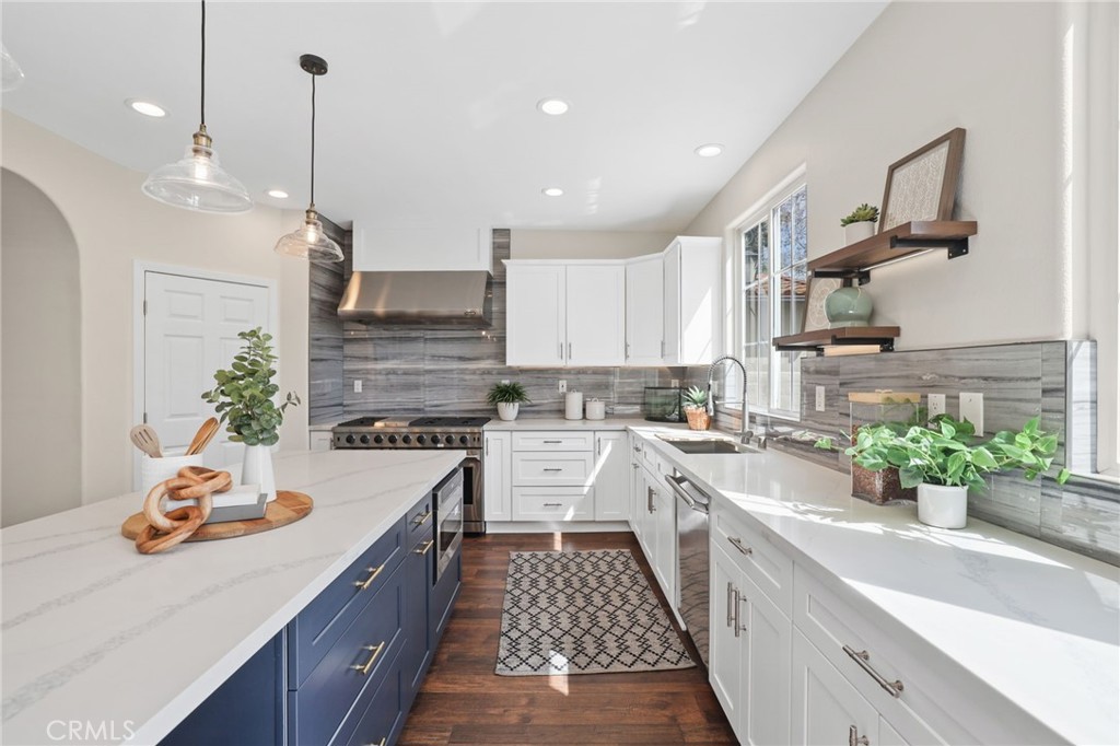 16 Kempton Lane Ladera Ranch, CA 92694 - Photo 13 of 43 a kitchen with a sink stove and cabinets