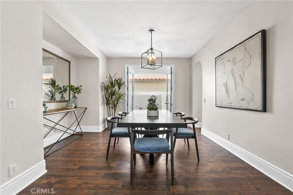 16 Kempton Lane Ladera Ranch, CA 92694 - Photo 18 of 43 a view of a dining room with furniture window and wooden floor