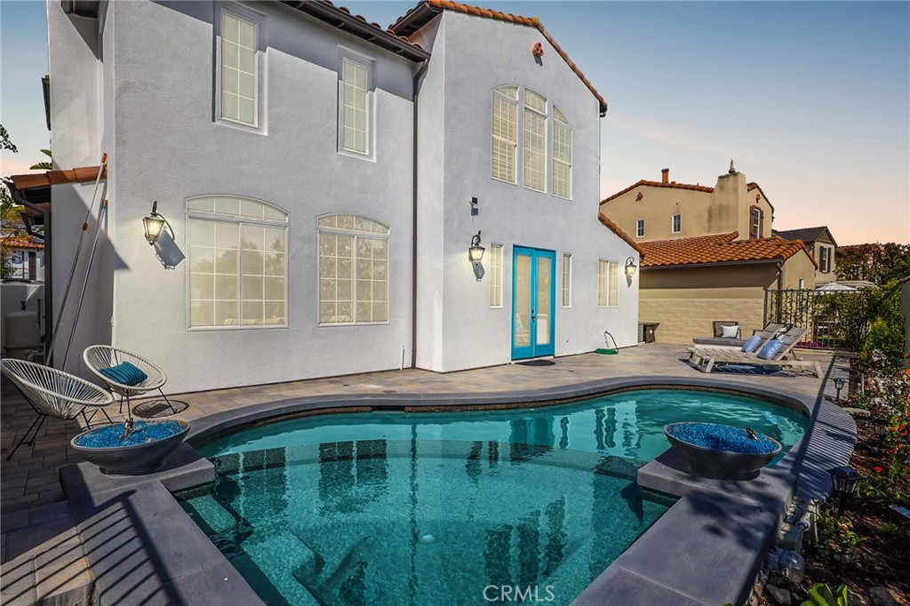 16 Kempton Lane Ladera Ranch, CA 92694 - Photo 2 of 43 a front view of a house with garden