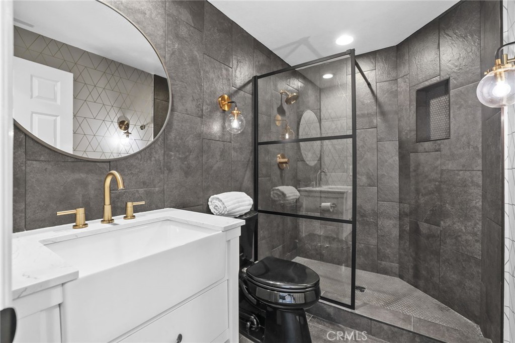 16 Kempton Lane Ladera Ranch, CA 92694 - Photo 21 of 43 a bathroom with a sink a toilet and shower