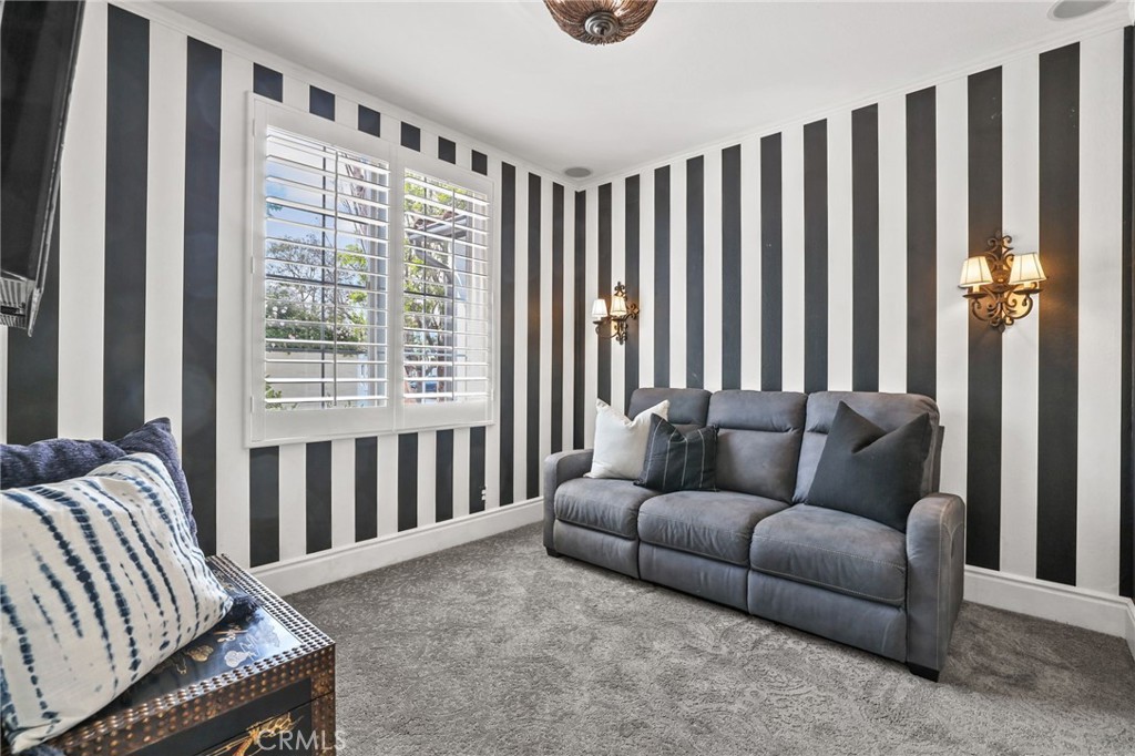 16 Kempton Lane Ladera Ranch, CA 92694 - Photo 22 of 43 a living room with furniture and a window
