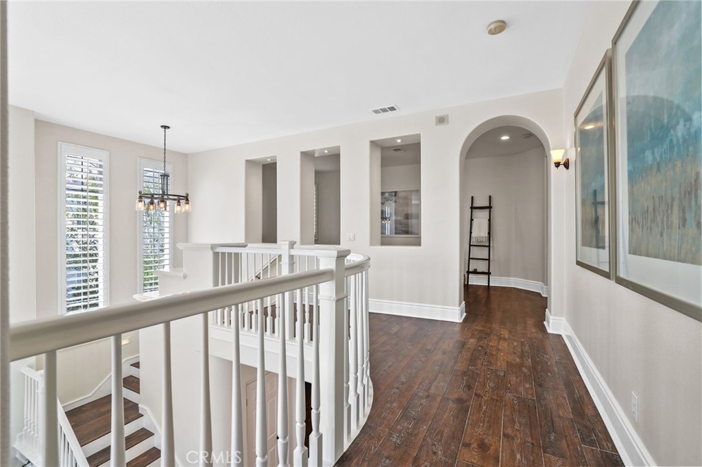16 Kempton Lane Ladera Ranch, CA 92694 - Photo 24 of 43 a view of entryway with wooden floor and windows