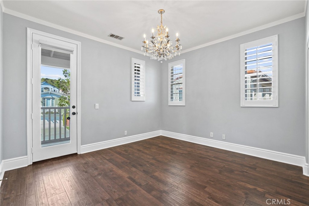 16 Kempton Lane Ladera Ranch, CA 92694 - Photo 26 of 43 a view of an empty room with wooden floor and a window