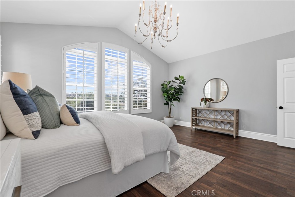 16 Kempton Lane Ladera Ranch, CA 92694 - Photo 31 of 43 a bedroom with a bed couch and a window