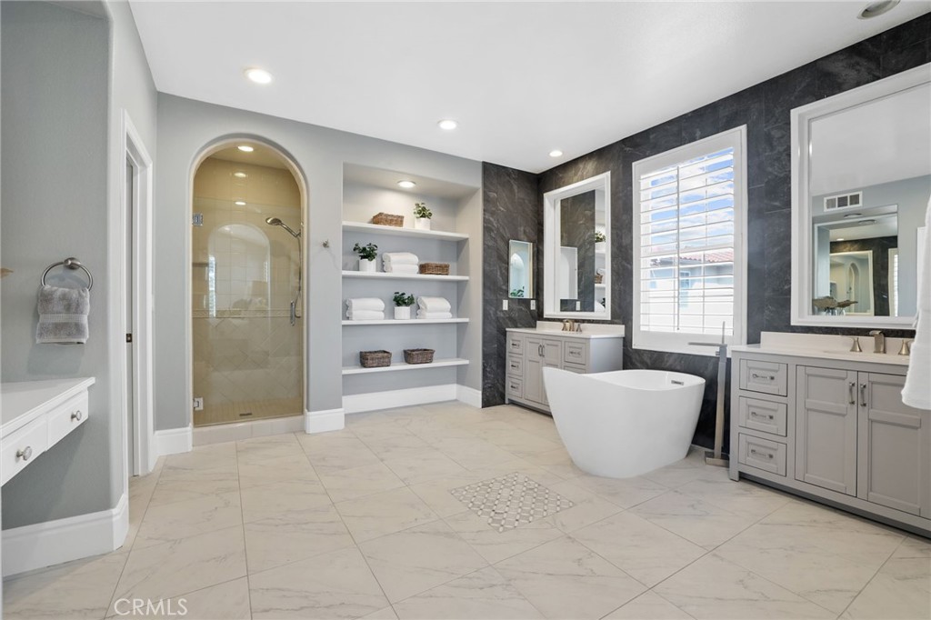 16 Kempton Lane Ladera Ranch, CA 92694 - Photo 32 of 43 a spacious bathroom with a granite countertop tub shower and sink