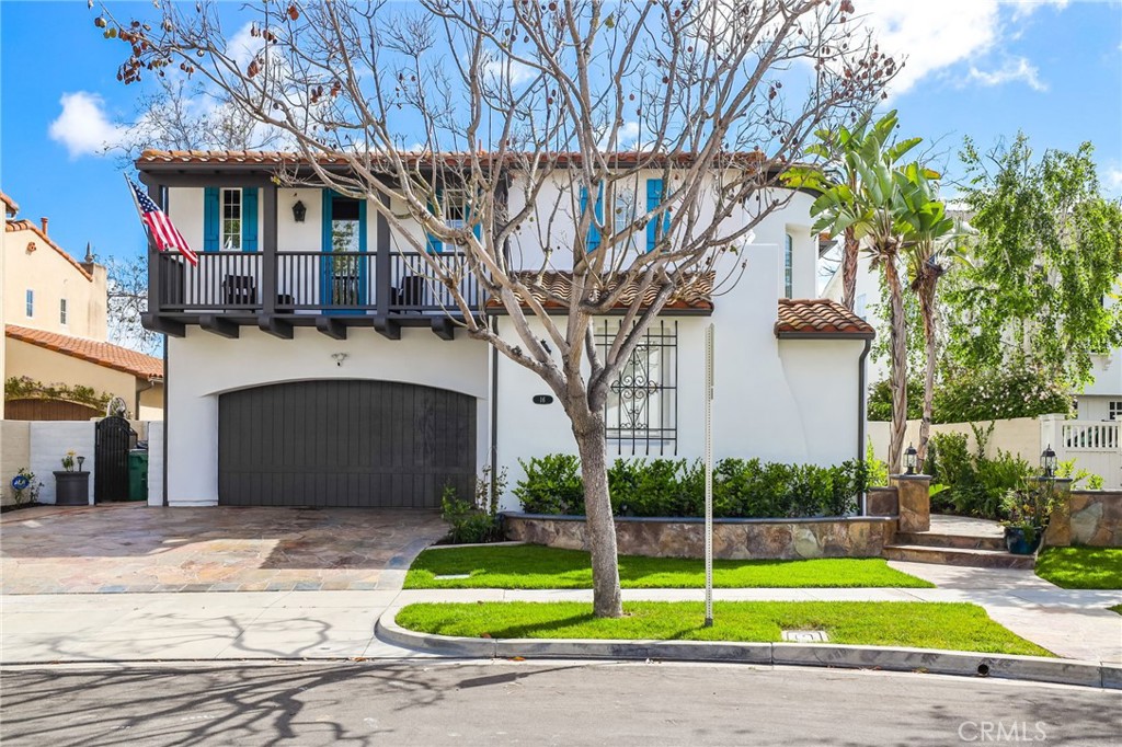 16 Kempton Lane Ladera Ranch, CA 92694 - Photo 4 of 43 a front view of a house with a garden and trees