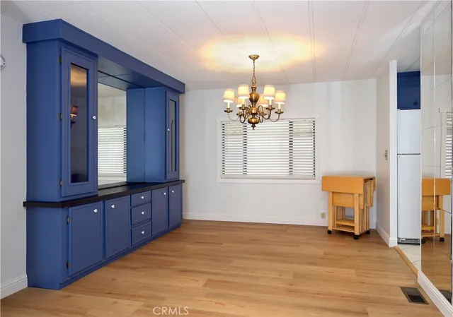 a view of a livingroom with a furniture wooden floor and cabinet