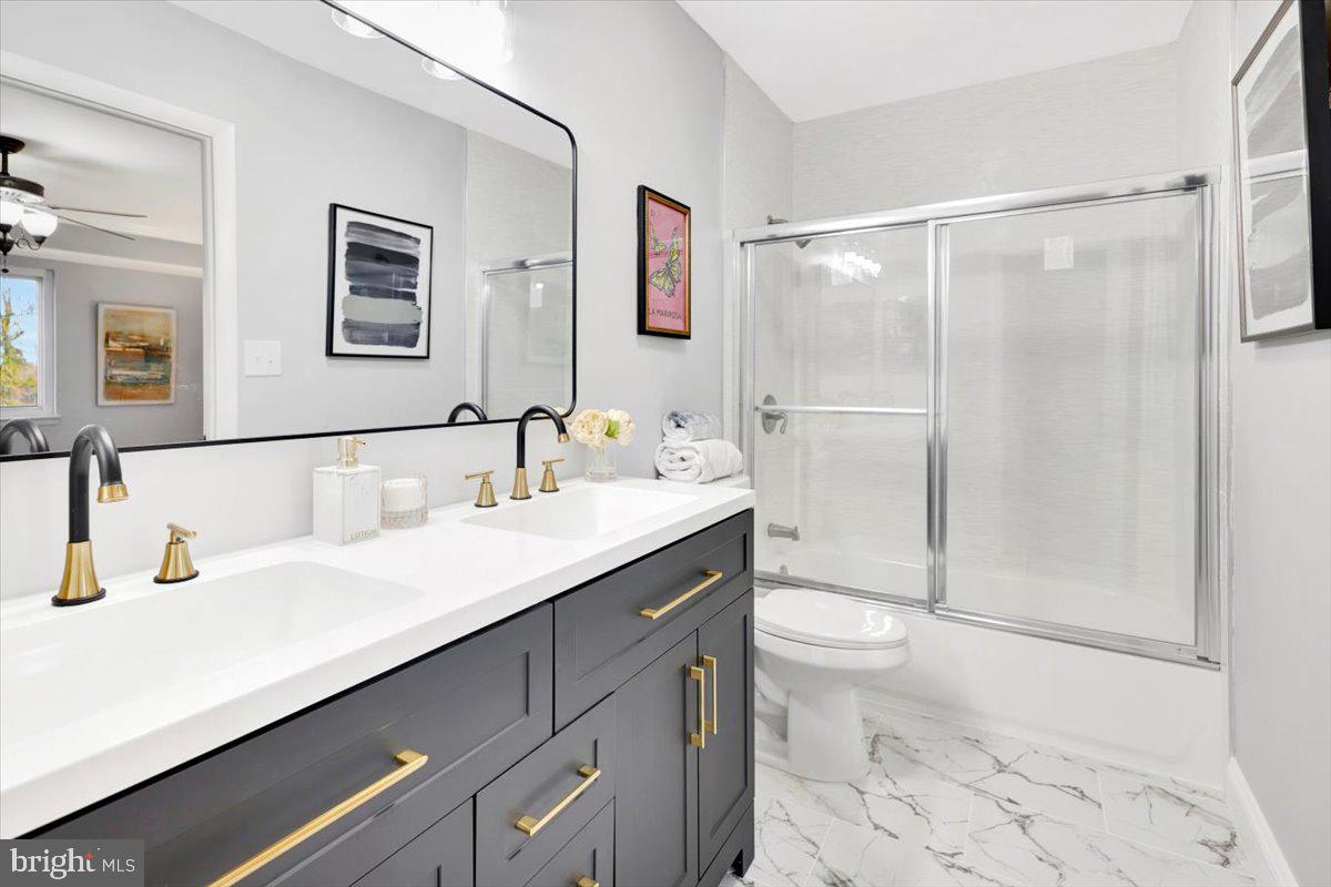 12 Stone Ridge Court Baltimore, MD 21239 - Photo 18 of 38 a bathroom with a sink a toilet and shower