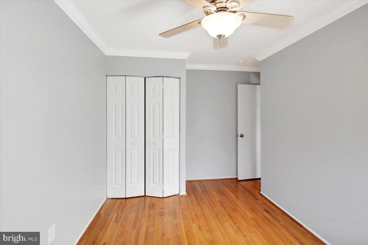 12 Stone Ridge Court Baltimore, MD 21239 - Photo 20 of 38 wooden floor in an empty room with a window