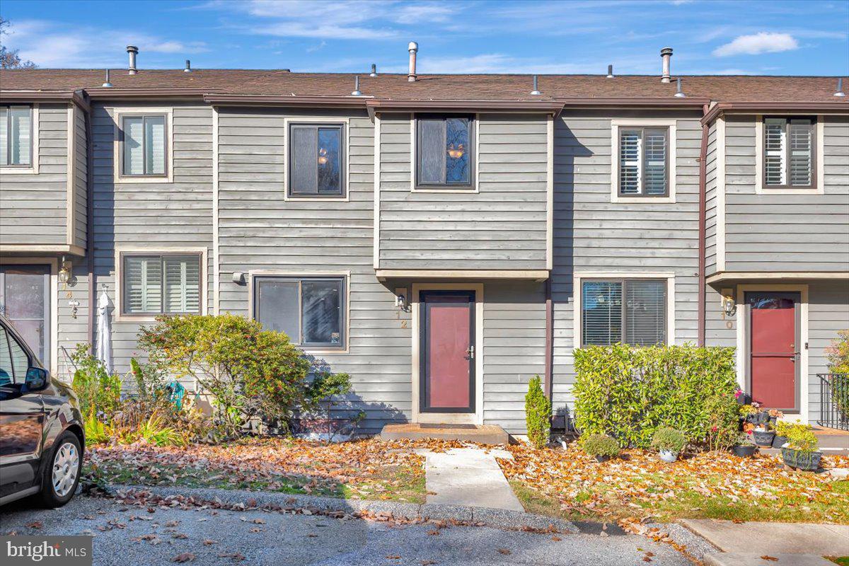 12 Stone Ridge Court Baltimore, MD 21239 - Photo 2 of 38 a front view of a house with a yard