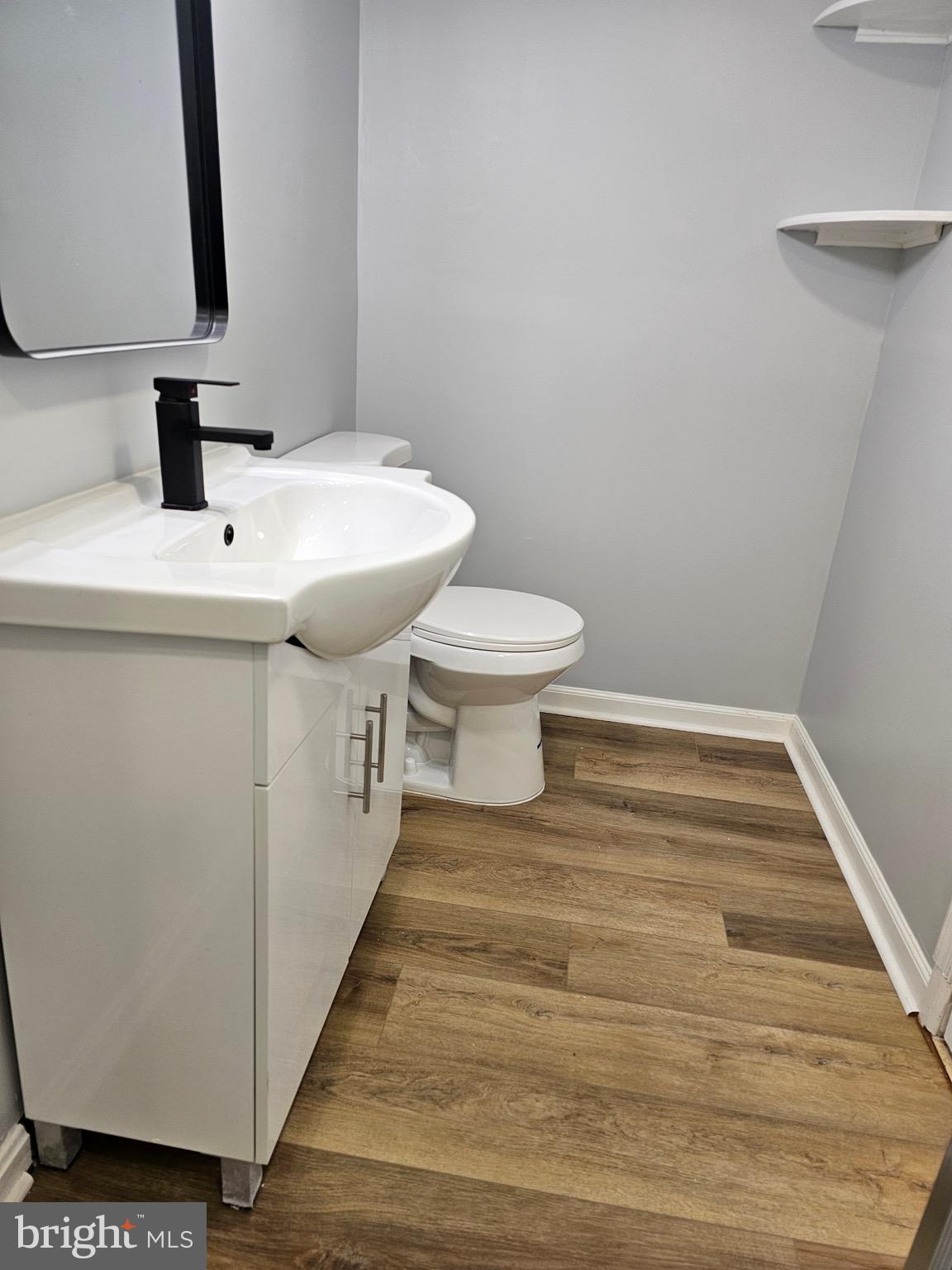12 Stone Ridge Court Baltimore, MD 21239 - Photo 28 of 38 a bathroom with a sink and a toilet