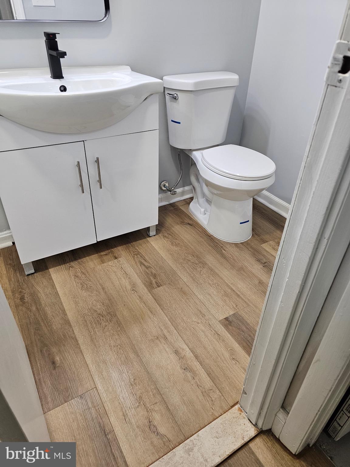 12 Stone Ridge Court Baltimore, MD 21239 - Photo 29 of 38 a bathroom with a toilet and a sink