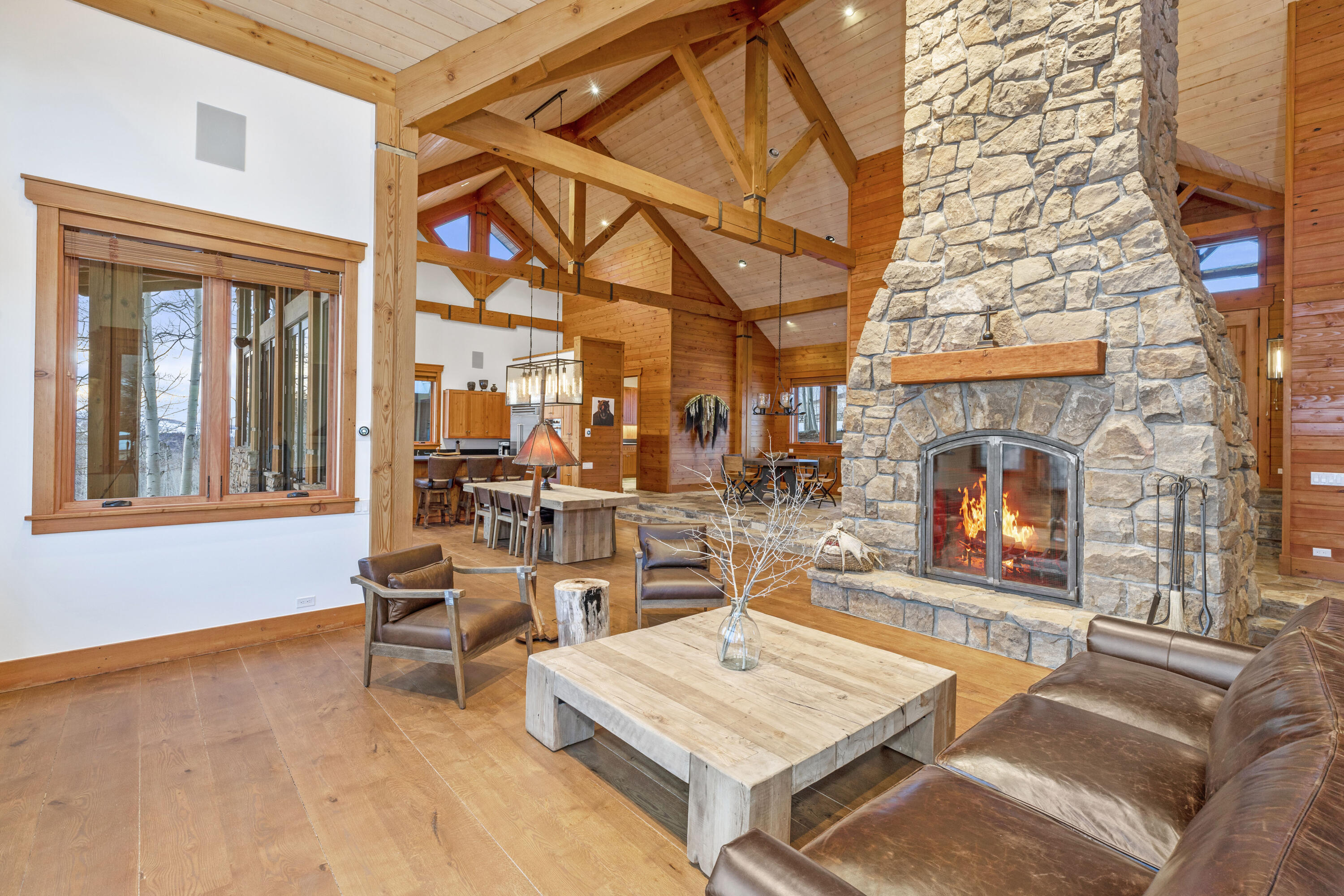 6800 County Road Telluride, CO 81435 - Photo 15 of 64 a living room with furniture a fireplace and a table
