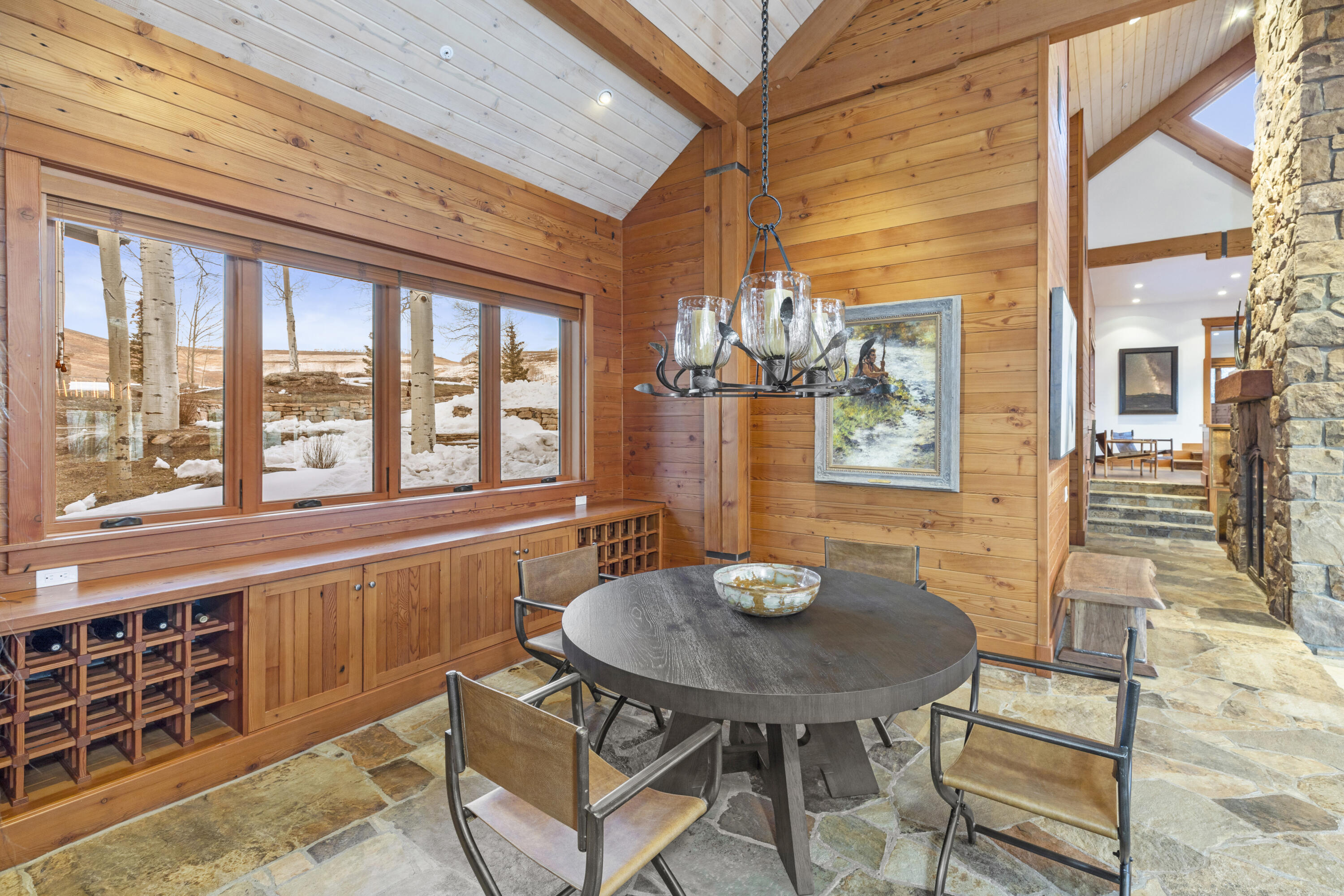 6800 County Road Telluride, CO 81435 - Photo 22 of 64 a view of a dining room with furniture and window