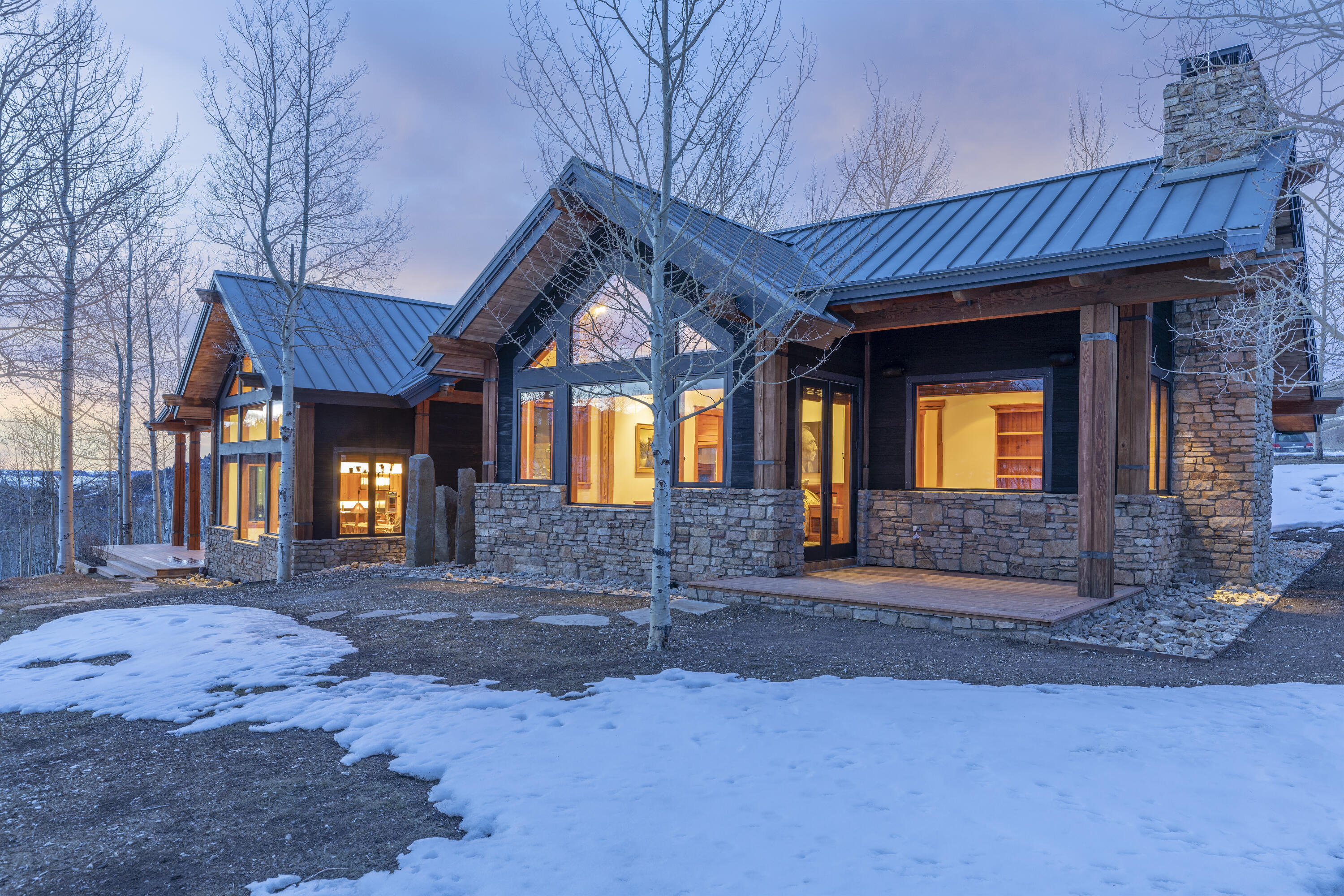 6800 County Road Telluride, CO 81435 - Photo 3 of 64 a front view of a house with garden