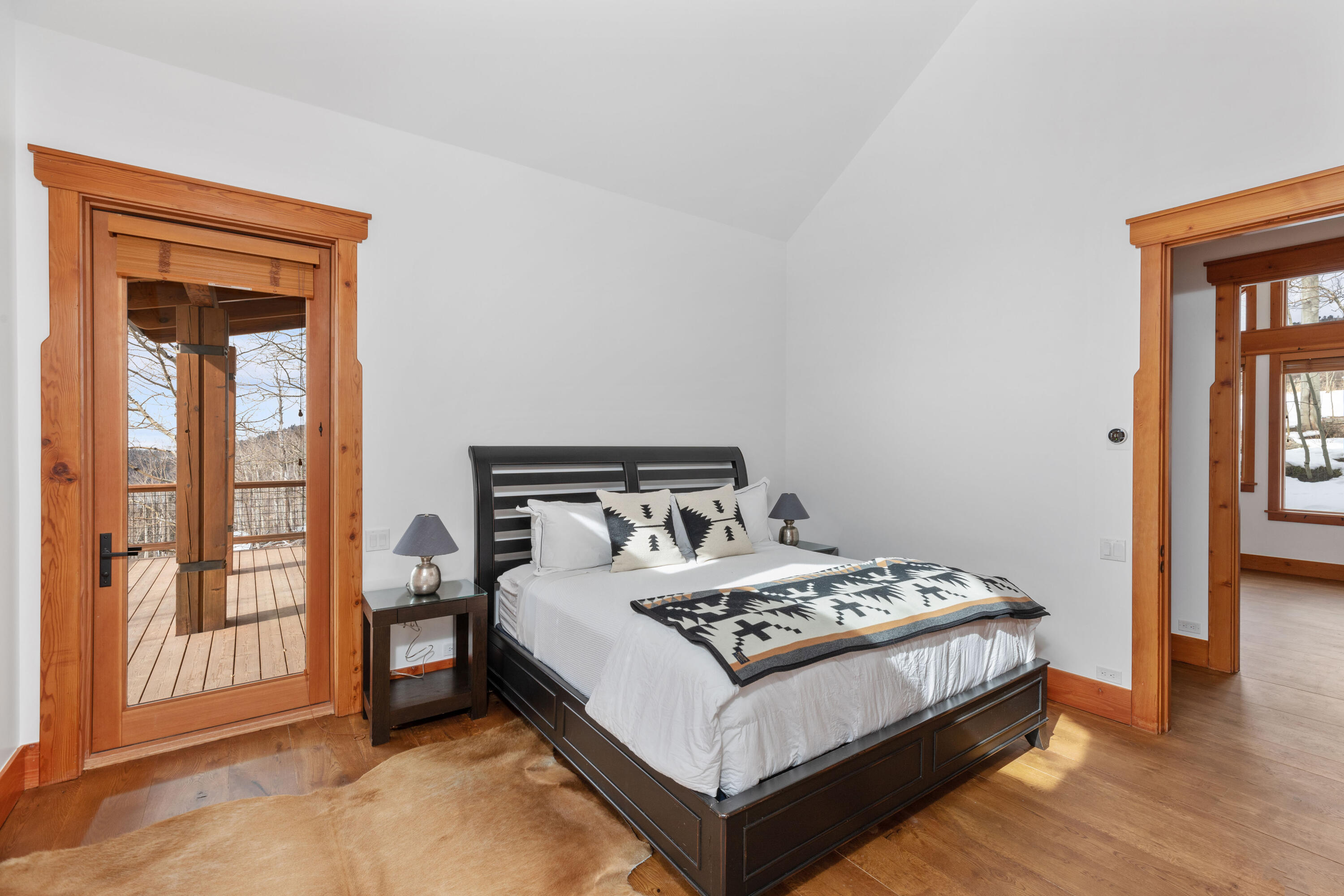 6800 County Road Telluride, CO 81435 - Photo 39 of 64 a bed sitting in a bedroom next to a window