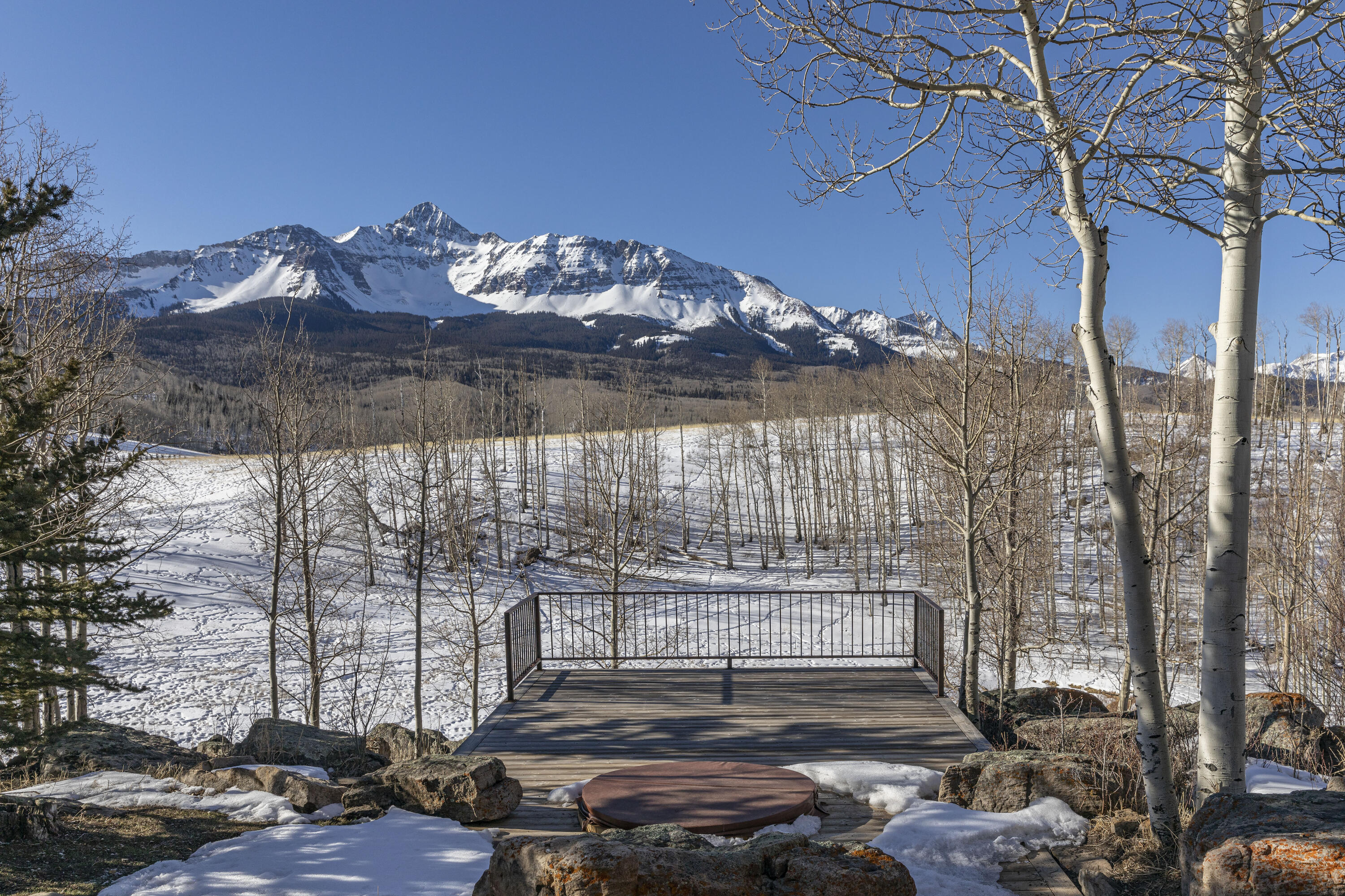 6800 County Road Telluride, CO 81435 - Photo 44 of 64 a view of a porch with a bench