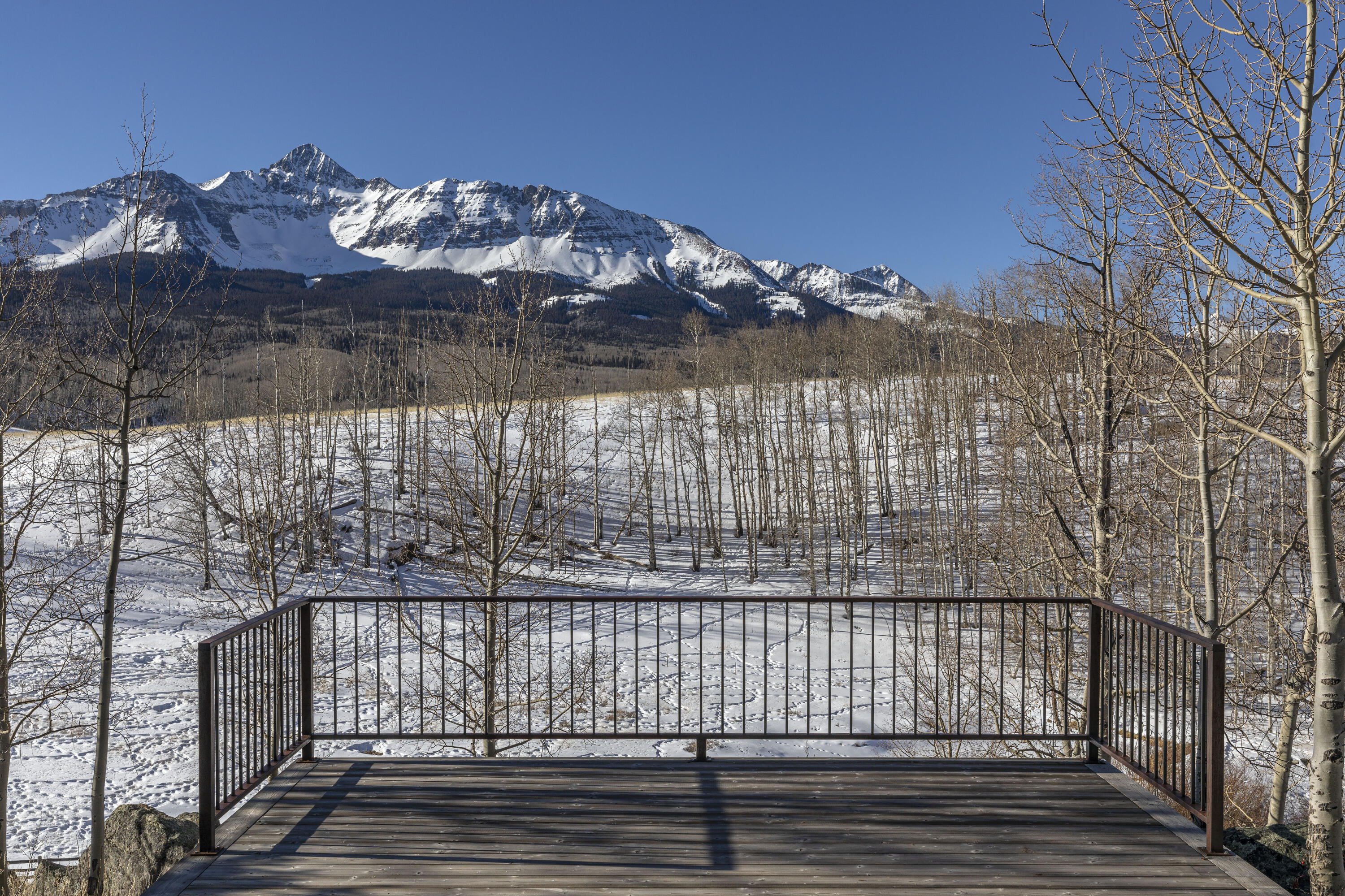 6800 County Road Telluride, CO 81435 - Photo 45 of 64 a view of a balcony with wooden fence